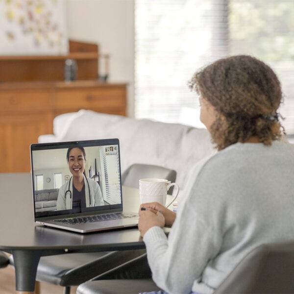 Woman meeting virtually with her doctor for personalized care