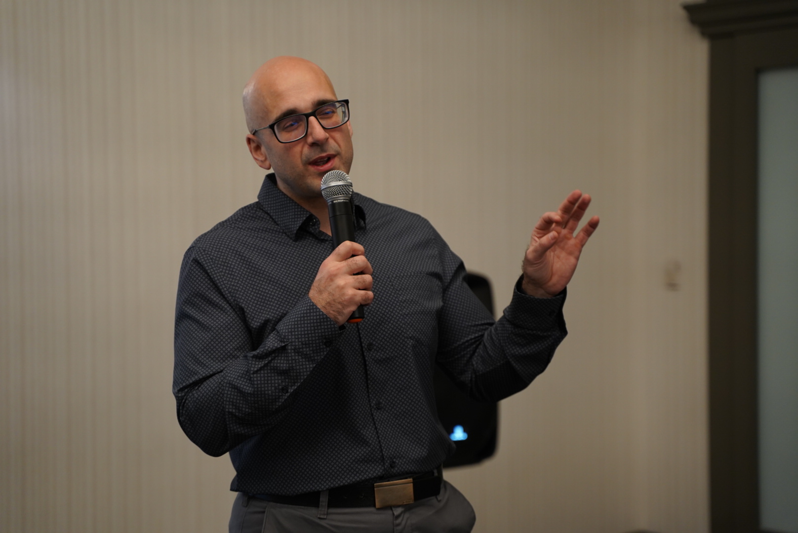 Dr. Tro Kalayjian speaking with a microphone
