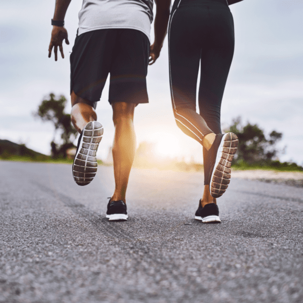 A man and woman walking outdoors