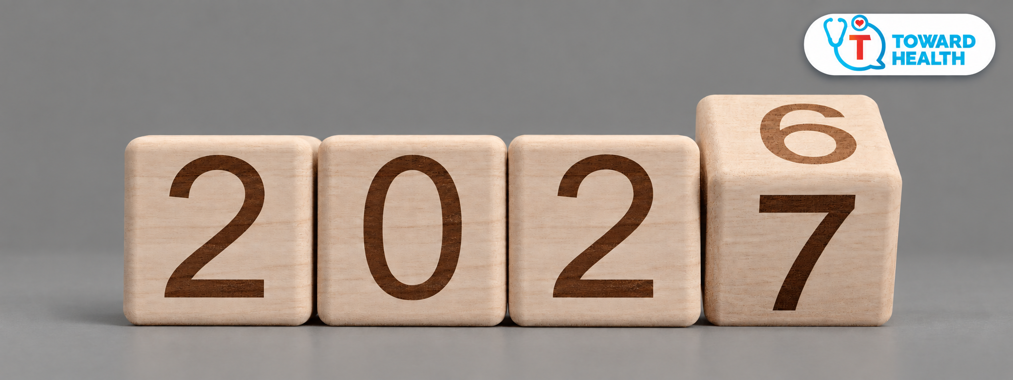 Amy’s Corner: #WhyWait — 2026 to 2027 - Toward Health Wooden calendar blocks changing from 2026 to 2027, with the Toward Health logo in the upper-right corner.